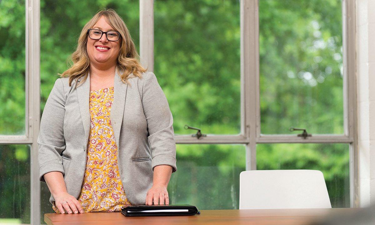 Woman standing at desk